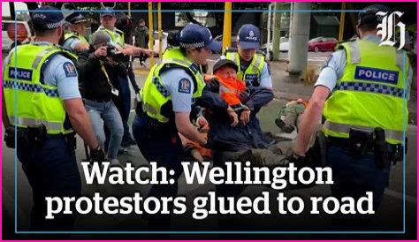 Watch: Protesters glued to Wellington Road